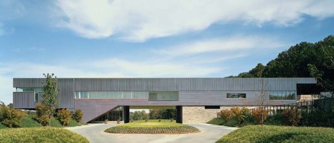 The discovery of Osage Indian artifacts led to much of the site being declared an archaeological zone, meaning that building could continue as long as the artifacts were not disturbed. For the clubhouse, which extends into the archaeological zone, Blackwell responded by creating two small footprints on the ground level to support a much larger cantilevered structure above.