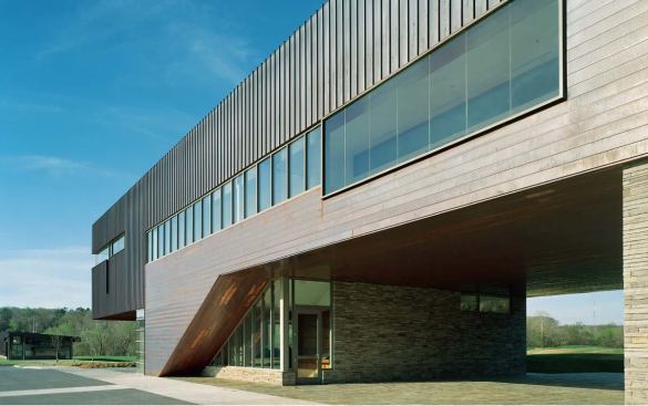 A combination of standingseam and flush copper cladding on the clubhouse exterior creates a difference in texture and variety of tone that help the building relate to the landscape.