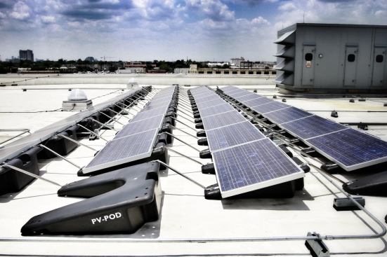 The PV-Pod is now commercially available for flat-roof installations. Optional interlocking braces can increase the wind  load capacity of PV Pods.