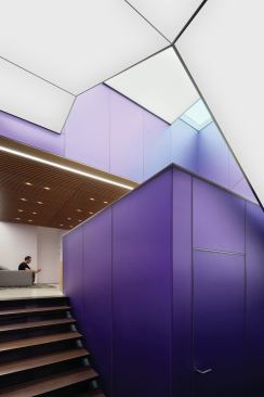 The lighting transforms the stair area of this two-story building into a sculptural configuration. 