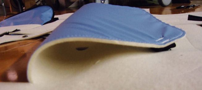 INTERIOR FELT "DRAPE"
Preliminary sketches for the felt drape system have been manufactured into large-scale mockups. There are voids in the felt to give access to the blue vapor barrier, and zippered pockets so that residents can actively use the surface for storage.