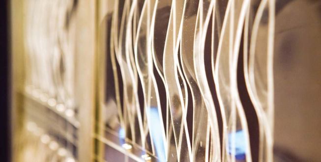 A lightweight, transparent building skin has gill-like openings that can close or open in response to the air quality of the surrounding environment, effectively allowing the building to breathe.