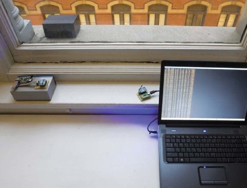 A sensor sits on the exterior window ledge gathering environmental air quality data while another sensor, uncovered, sits inside to monitor the interior air quality. The data are all routed to a software program that the team intends to publish so that others can create similar systems in other cities.