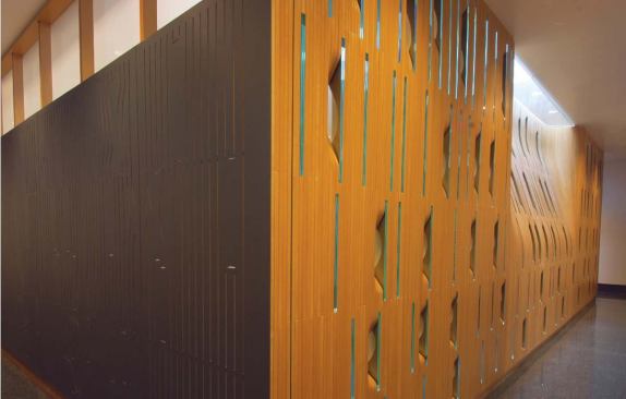 A section of the east wall bows into the slide library to direct light from the room's skylight into the adjacent hallway.