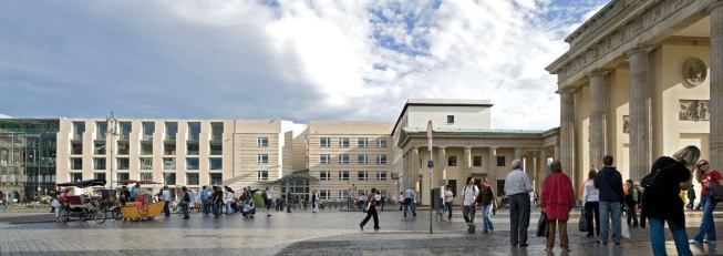 The U.S. Embassy in Berlin (center) at the Brandenberg Gate (right).