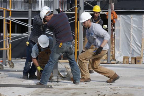Students putting a steel column in place.