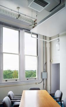 While secreted in most of the building's historic spaces, the new high-efficiency HVAC system can be seen in a third-floor conference room and restroom. 