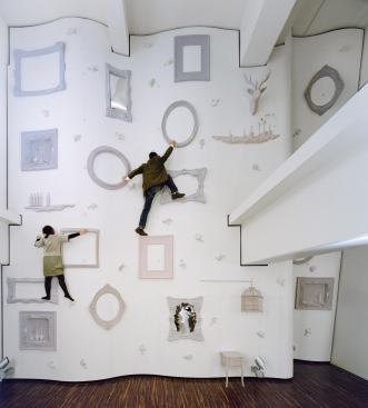 Nendo designed an unconventional two-story climbing wall in the Illoihoa Omotesando fitness club in Tokyo.