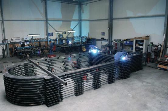 The team welded the layers and columns into groups that the crane could lift into place on site.