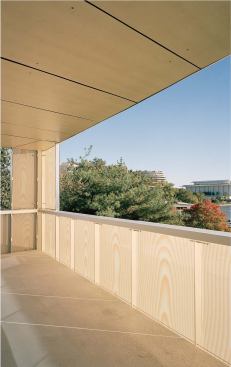 The subtle wood-grain pattern of the glass in the building's balconies (left) can look warm or cool, depending on the light level. To achieve the wood-grain effect, Scandinavian Glass Systems printed an enlarged maple pattern on special digital film, placed the film between tempered glass panes, and baked the assembly at a high temperature-a technique the company had used once before, in collaboration with a Korean artist.