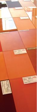 A series of reddish-toned glass creates a varied appearance. 