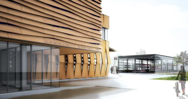 The site has two distinct buildings-a wood-louvered structure with boat storage and program space and a glass-shingled boat hangar.