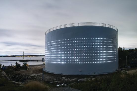 To illuminate the interior and exterior of the project, the team perforated the exterior surface of the 56-foot-tall tank.