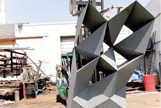 For a refined design of the steel skin, the architects commissioned a full-scale mock-up of a section of the band shell/projection screen. The same material system encloses a multipurpose structure near the entrance to the site.