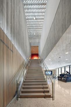 As visitors make their way up the main staircase, the low ceilings of the lobby give way to lofty skylit galleries on the second floor.
