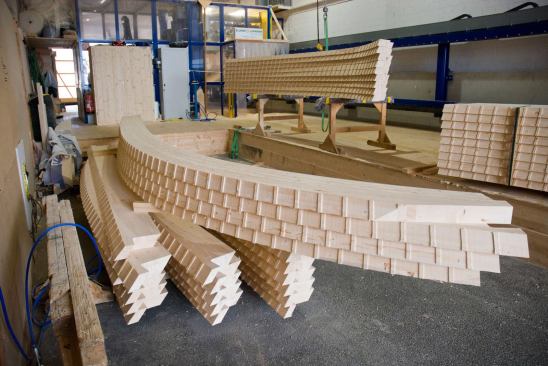 The curved beams were fabricated by Swiss timber consultant Blumer-Lehmann.