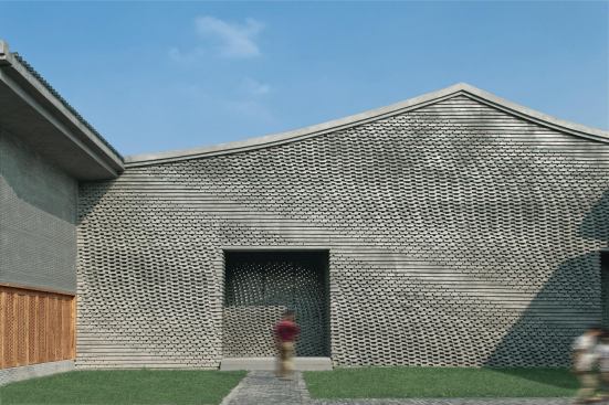 The brick walls comprise two wythes of masonry that sandwich the building columns.