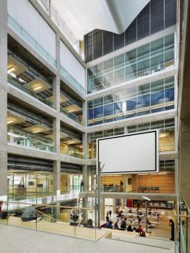Inside, the building is programmed around a five-story atrium with a monumental staircase that serves as a social gathering space for the students.