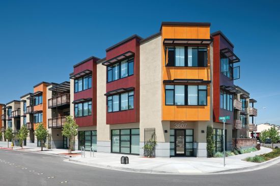 Main Street Village Apartments exemplifies sustainability by transforming a vacant lot into a densely planned mixed-use and transit-oriented development. 