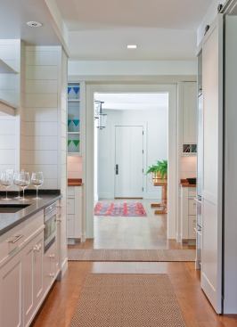 Equipped as a secondary kitchen, the butler's pantry organizes circulation and activities as well as food.