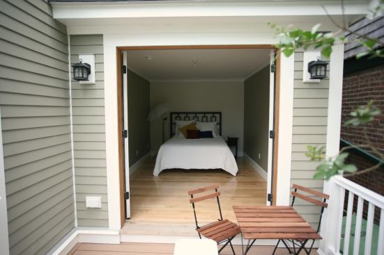 The guest bedroom opens onto a small deck.