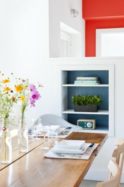 Extra storage is tucked away in built-in bookshelves.