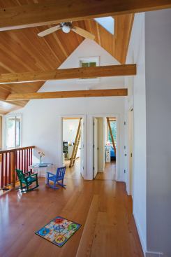Children’s bedrooms spill out to an airy play loft. 
