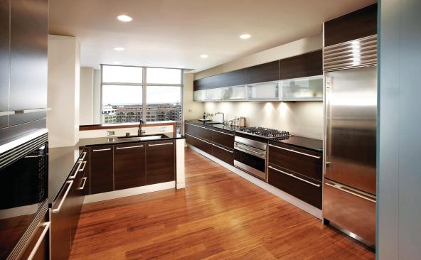 Cabinetry laid out in long, horizontal bands directs attention toward views of downtown Milwaukee and Lake Michigan in the Blur Loft. 
