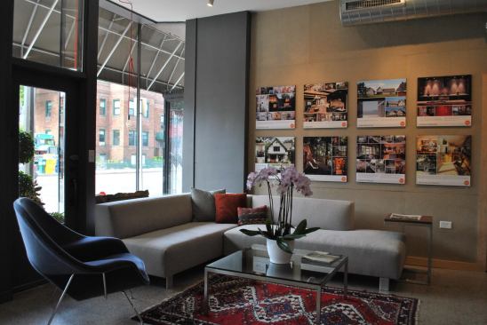 The residential-like waiting area near the front is a nod to the firm's focus.