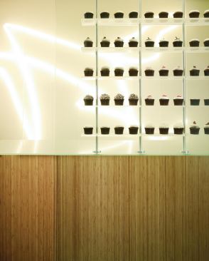 At More Cupcakes, a new store in Chicago's Gold Coast neighborhood that was designed by David Woodhouse Architects, the humble cupcake is treated like the main design object of an otherwise minimal, meticulously detailed interior.