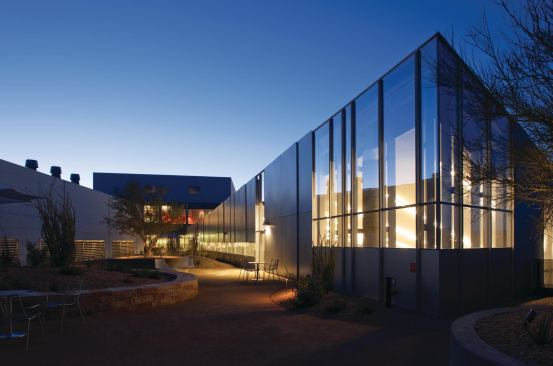 An expansive roof garden on the third floor—designed by Christy Ten Eyck of Ten Eyck Landscape Architects—provides outdoor space for employees to eat, have meetings, and stage events. A door connects this exterior space to the mezzanine in the cafetorium, and windows look down into that double-height space.