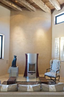 Building Envelope

 The R-7 SeriousWindows units feature krypton gas, heat mirror glass, and insulated fiberglass frames. For the walls, Dancer chose Applegate’s 85% recycled paper insulation for its low embodied energy and high R-value. SeriousWindows: 877.797.1206. www.seriouswindows.com. Applegate: 800.627.7536. www.applegateinsulation.com. Walls Interiors were finished with low-VOC Tobias Stucco wall finishing mixture or painted with Benjamin Moore low-VOC paint. Tobias Stucco: www.tobiasstucco.com. Benjamin Moore: 855.724.6802. www.benjaminmoore.com.

Wood-Burning Fireplaces

 Dancer speced clean-burning, sealed-combustion Wittus fireplaces to provide backup heating in the living room and master bedroom on especially cold days. He says they are rarely used due to the home’s exceptional insulation package and geothermal heating system. 914.764.5679. www.wittus.com.