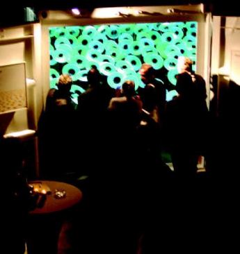 Color-changing illuminated discs recall a field of flowers in Mansilla + Tunon's "Spring of Light" container installation (above).