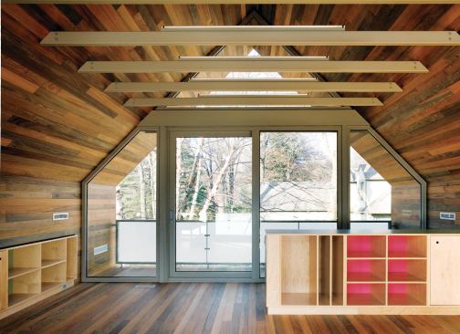 El Dorado used Sinker Cypress recovered from Louisiana swamps for the wood cladding and flooring of a new playroom addition above the garage.