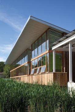 The LEED-Platinum Omega Center for Sustainable Living in Rhinebeck, N.Y., designed by BNIM, uses cypress salvaged from mushroom farms, beech reclaimed from former factories, and planks from the 2009 inauguration platform of President Barack Obama.