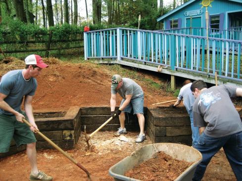 Last year, students from Southern Polytechnic State University's Freedom by Design chapter designed and built a patio extension—including retaining walls made from railroad ties and topped with planters—at the home of 11-year-old Marcella Genut, who has muscular dystrophy.

