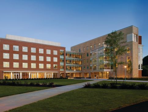DiMella Shaffer used terra-cotta (at right in photo) on about 25 percent of Crimson Hall. The tiles' sandy color and size—14 inches high by 4 feet long—provide a sharp visual contrast against the smaller red bricks.