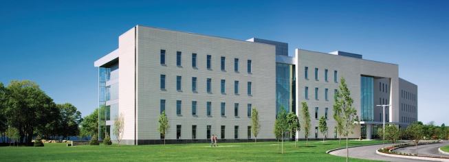 Payette used a terra-cotta rainscreen system to cover the entrance face of the Meditech Computer Science Building. In addition to offering a contemporary riff on the areas historical architecture (mills built from stone), the terra-cotta absorbs the sun's heat, insulatating the interior with an R-value of 12.5.