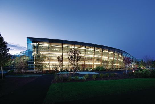 Behind the south façade of the new SAP Americas Headquarters is an atrium that serves as a circulation spine. Facing an existing building across a landscaped courtyard, the triple-glazed façade provides a visual connection to the goings-on in the office space. The proximity of the new and old buildings has allowed SAP to streamline operations, such as having one central IT hub instead of the three required to support the staff when they were separated into rental spaces. The courtyard is Wi-Fi enabled, allowing employees to work outside on warm days.