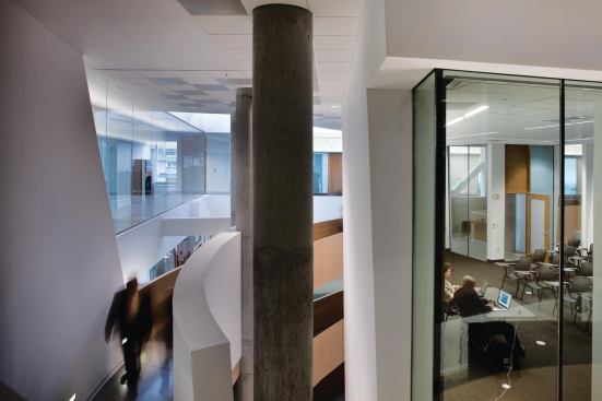 In the Gates Center, a central 650-foot-long spiral ramp called the Helix 1 visually connects four stories even as it wraps around glass-enclosed classrooms and meeting spaces.