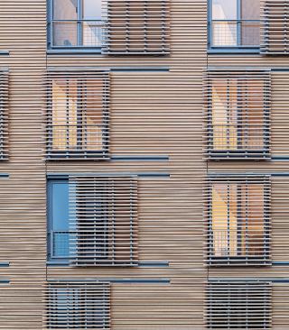 Cypress cladding and movable louvers.