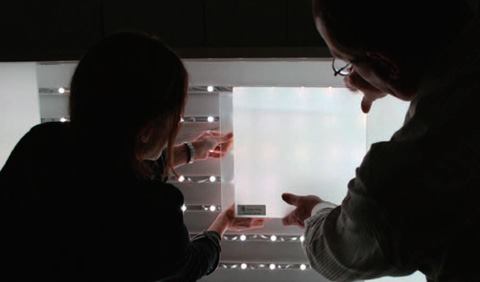 Over 270,000 red, green, and blue LED nodes, uniformly spaced, are attached to the glass behind the ceiling and wall surfaces.