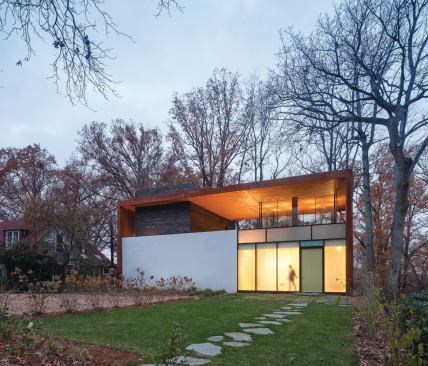 The Dahlonega Residence, completed in 2012, juxtaposes rough burned wood and Cor-Ten against smooth plaster and both translucent and transparent glass.