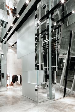 Kinetic mirror installation over cash wrap