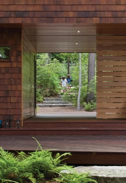 Architect Tom Murdough designed the house so the path from the lake goes right through the property. Because it’s the first building you arrive at when you walk up the path from the lake, the home functions as a gatehouse.  