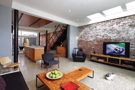 The best pieces of salvaged wood went to furniture and built-ins in the home's main living area.