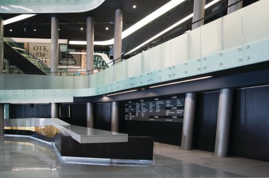 A lobby in the base of the atrium contains shop directories and elevator and escalator access to the upper levels.