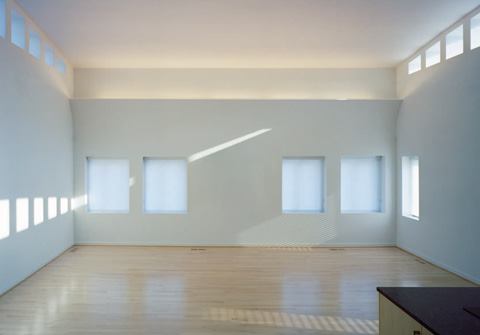 With no exterior views to speak of, the lighting design turns this apartment's focus inward, emphasizing the presence of daylight and how it moves through the space from morning to night. 