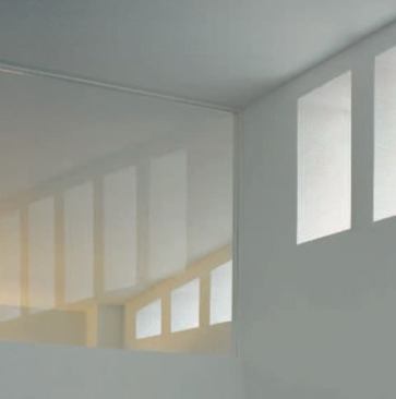 A glass clerestory allows light into the bedrooms, bath, and study, while continuing the theme of top light, which rings the apartment. 