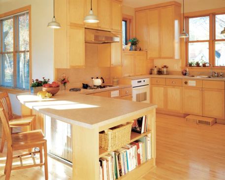 There’s room in the light-filled kitchen and under the curved peninsula to accommodate Barb Gasterland’s wheelchair when she needs it.